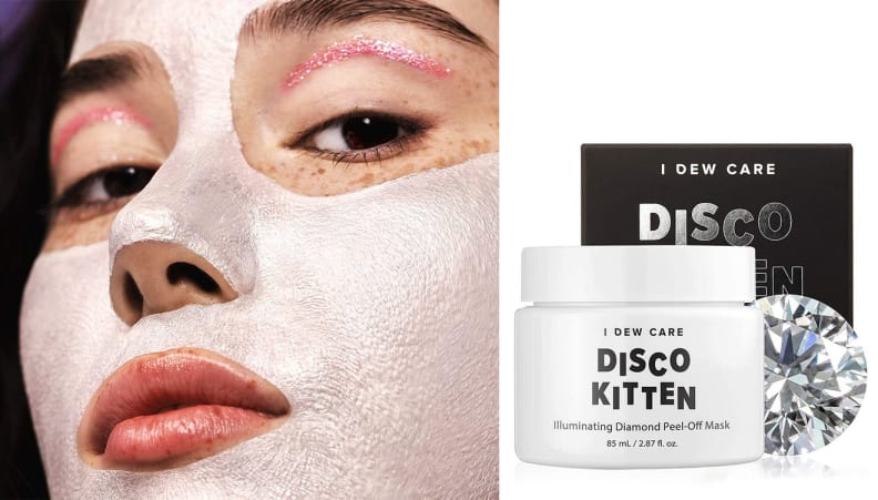 A person spreads a face mask over their visage.