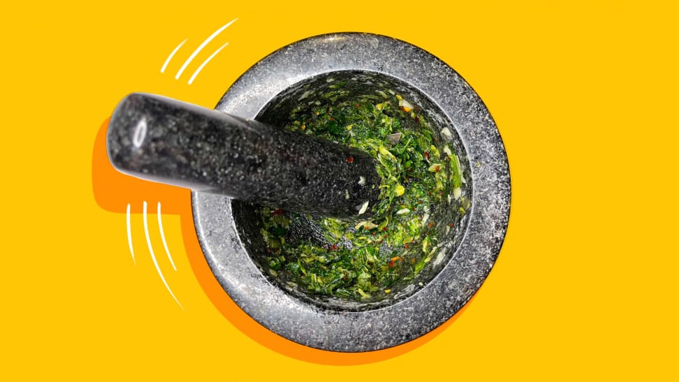 A top-down photo of freshly made shisho chimichurri in a mortar and pestle.