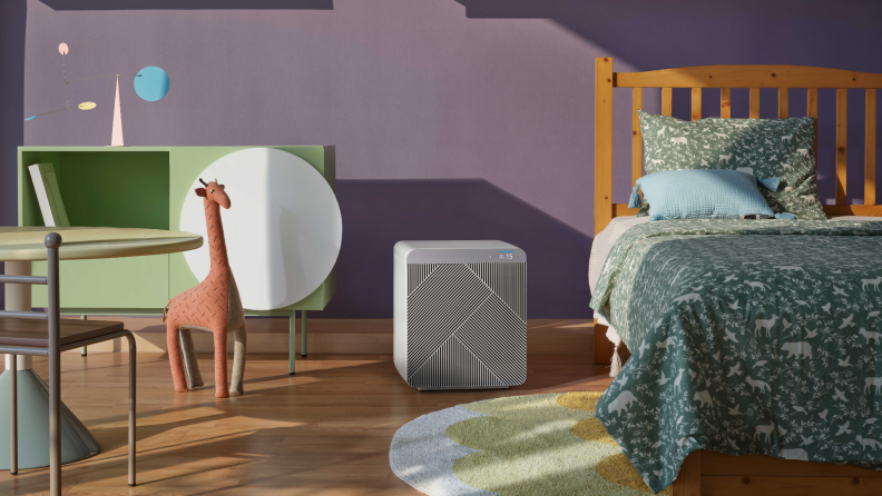 A Samsung Bespoke Cube smart air purifier sits in a child's bedroom.
