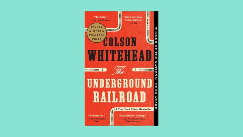 The book cover to "The Underground Railroad" by Colson Whitehead features a railroad-themed book design.