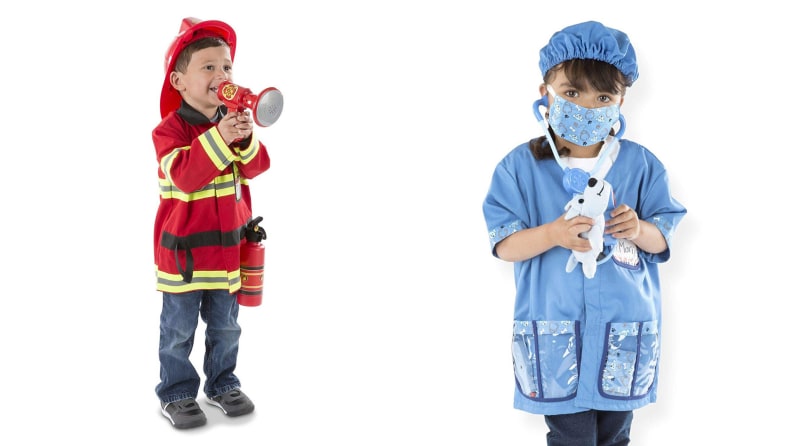 A child wearing a firefighter costume and a child wearing a doctor costume.