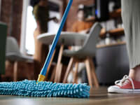 A person mopping the floor.