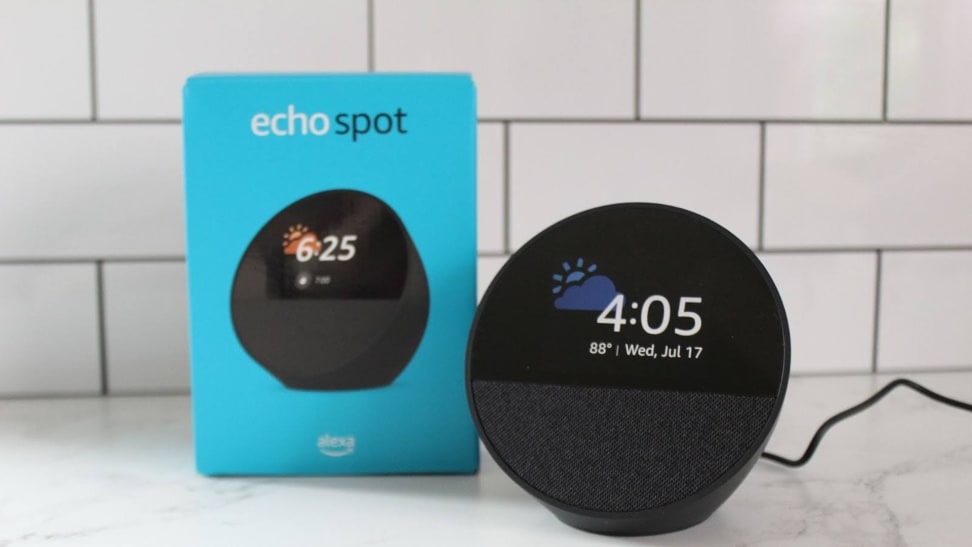 The new Amazon Echo Spot next to its packaging on a marble countertop.