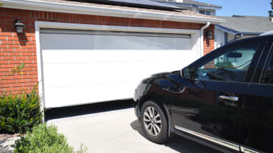 A car parked outside of a home