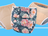 A peach-colored diaper, a floral print diaper, and another peach diaper against a blue background
