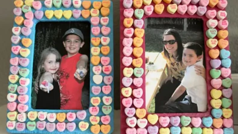 Two candy heart frames with family photos.