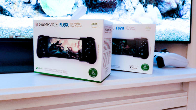 Two boxes for the Gamevice Flex on a TV stand, one for Android and one for iOS.