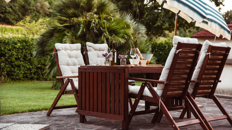 Wooden patio table set outdoors.