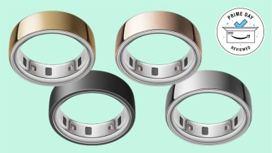 Oura rings in front of a mint background