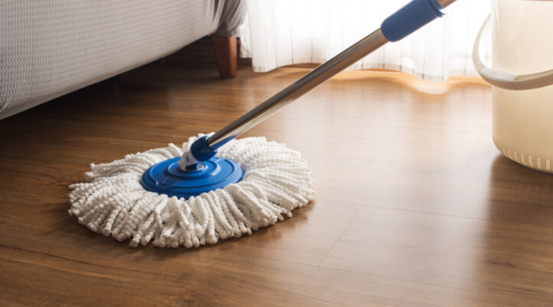 A mop cleans hardwood floors.