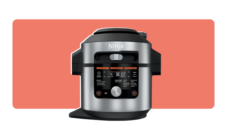 A silver and black Ninja Foodi OL701 pressure cooker.