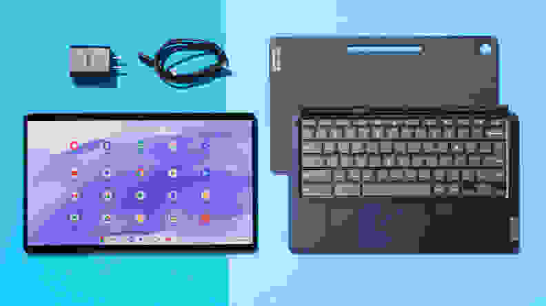 The Lenovo IdeaPad Duet 5 detached from the black keyboard, side-by-side, and the charging block and cord is above the IdeaPad screen.