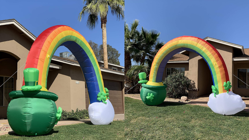 Inflatable rainbow arch with pot of gold in front yard of home.