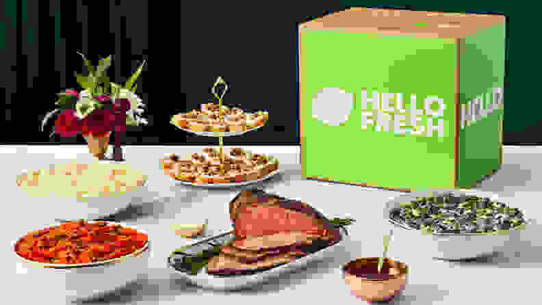 Prime rib and sides on a table with a HelloFresh box.