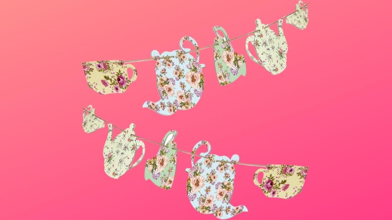 A hanging teapot and tea cups banner in front of a background.