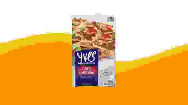 A product photo of Yves Veggie Pepperoni on an orange and beige background.