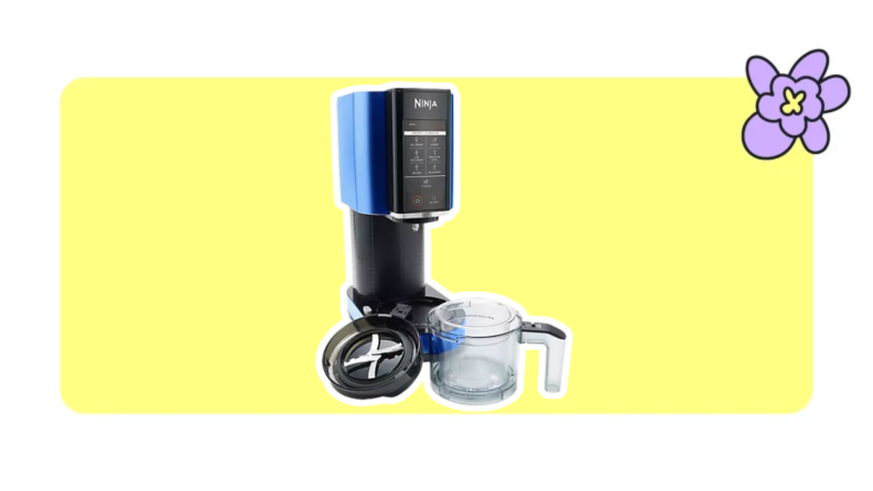 A Ninja CREAMi ice cream and frozen treat maker with a sleek black and blue design is displayed on a bright yellow background, alongside its transparent pint container and lid, with a purple cartoon flower in the top right corner.