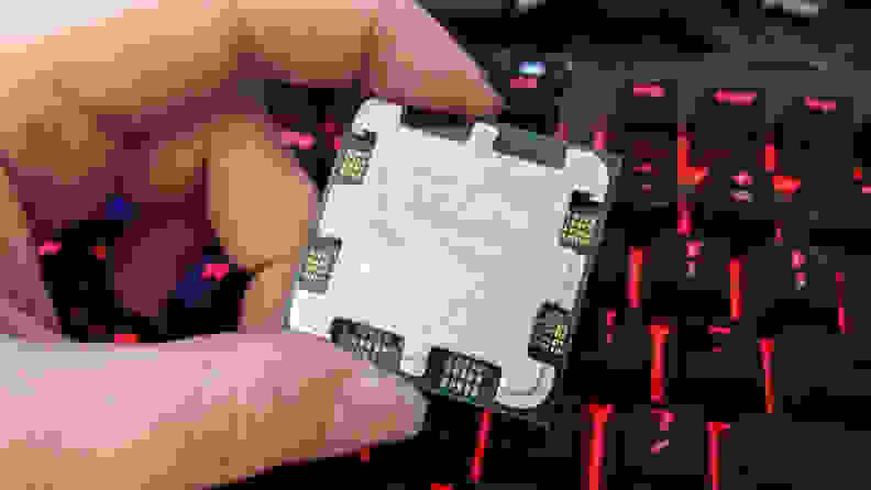 Holding a computer processor in-between fingers