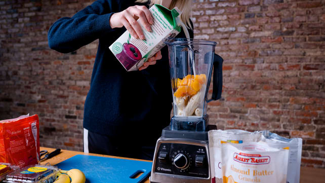 Adding milk to blender