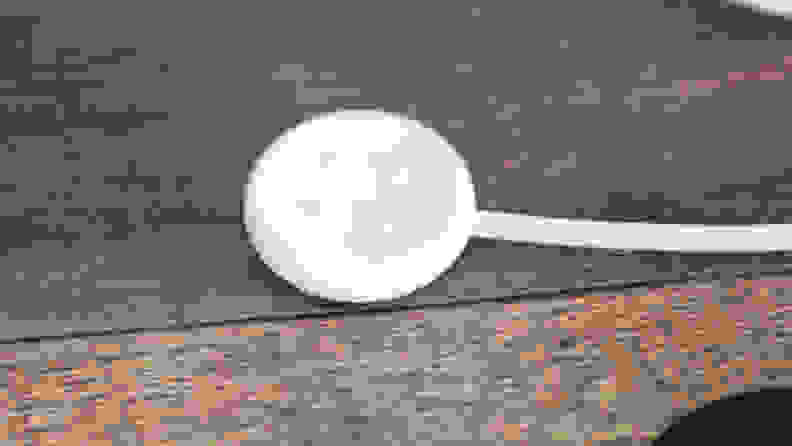 The Pixel Watch 2 sharger, with its pogo pins on display.