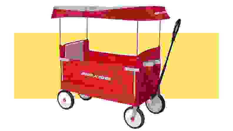A red Radio Flyer outdoor wagon on a yellow background.