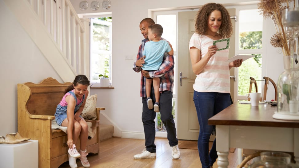 A family of four returns home.