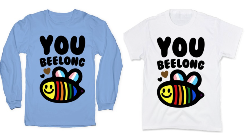 On left, blue long-sleeved shirt that read "You Beelong" with rainbow pride flag. On right, white short-sleeved shirt that read "You Beelong" with rainbow pride flag.