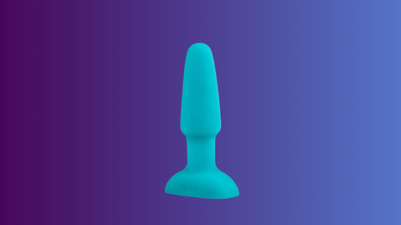 An anal sex toy sits on an indigo fade background