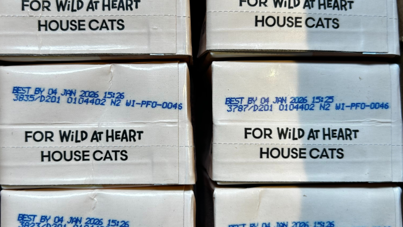 Boxes of Really Great Cat Food arranged upside down.