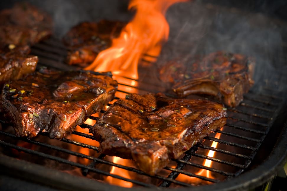 Steaks on a fiery grill