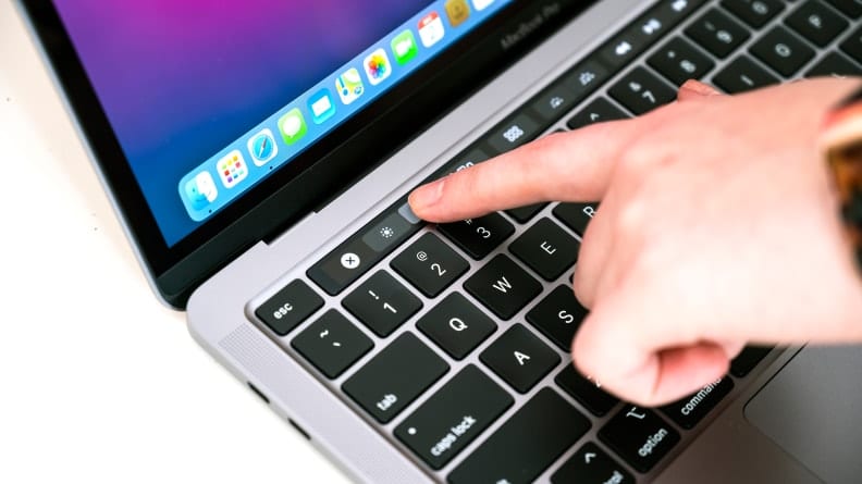 Person slides on Touch Bar using a finger