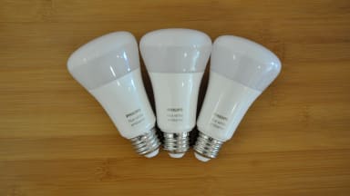 Three Philips Hue bulbs on table