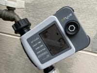 The Orbit B-hyve XD Hose Faucet Timer connected to a hose