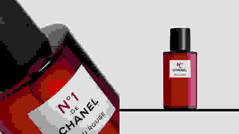 On the left: A closeup on a red transparent fragrance bottle with a white square label on it. On the right: A red transparent bottle of fragrance standing on a shelf.