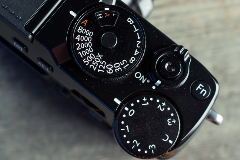 Pretty much all cameras have some kind of exposure compensation tool, either a button you press or a dial like on this camera.