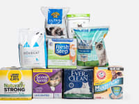 Nine packages of cat litter stacked in a pyramid