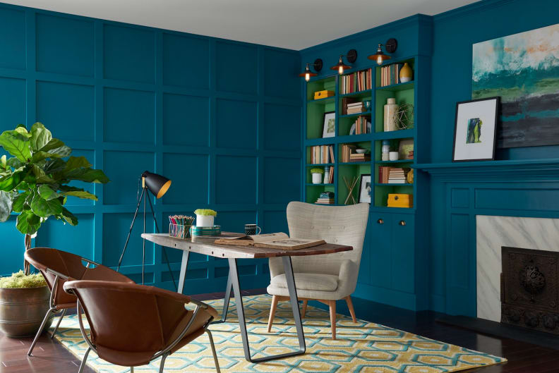 A deep teal envelops this room