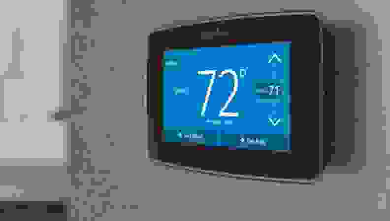 the sensi smart touch thermostat mounted on the wall