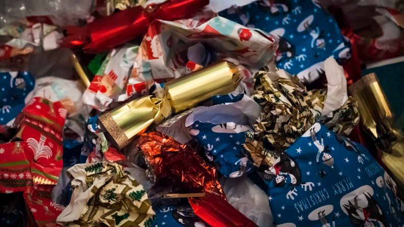 A pile of discarded gift wrapping and ribbon.