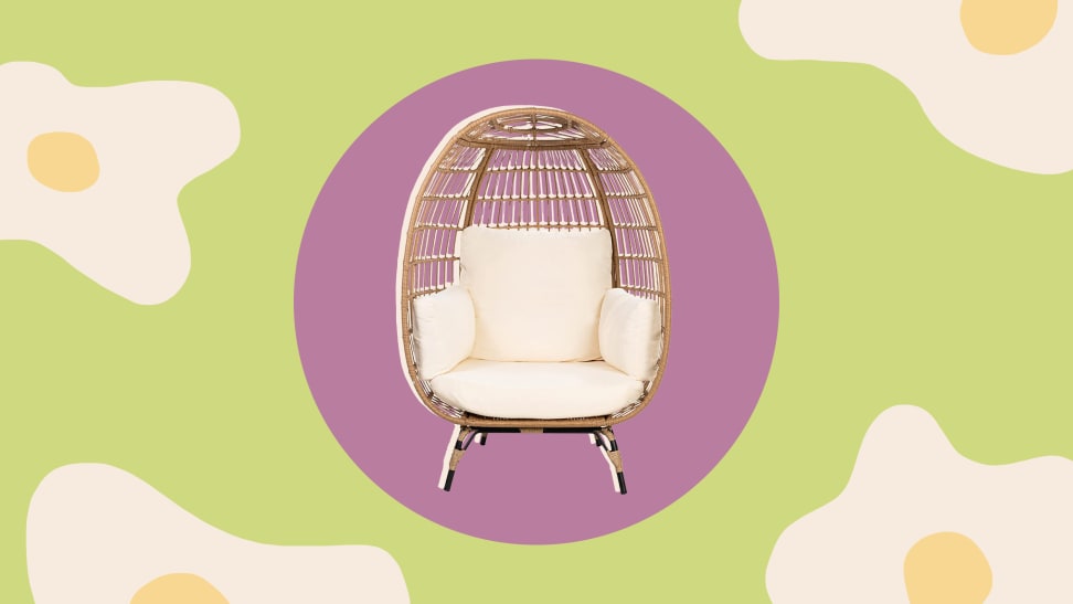 An egg chair inside a pink circle surrounded by a floral print.