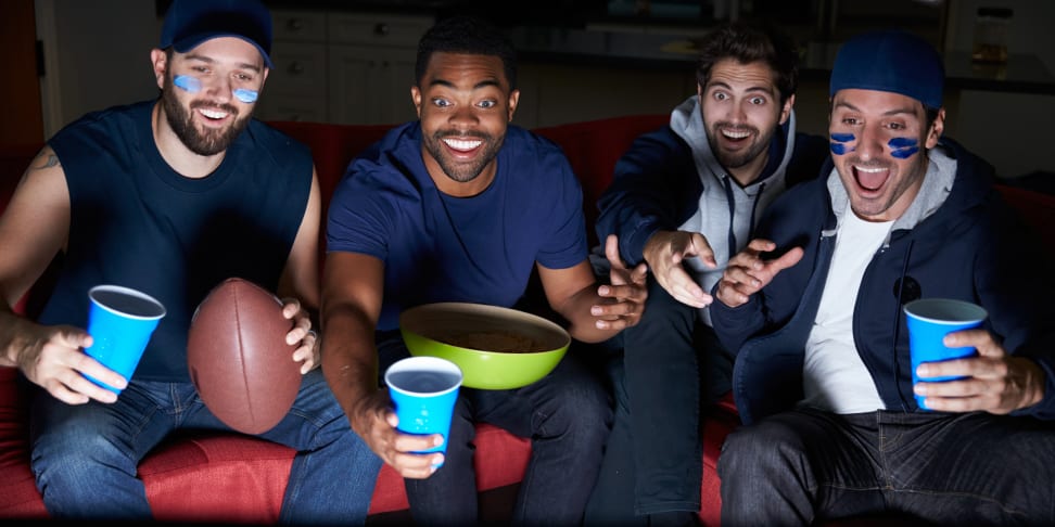 Fans watching football, probably over the air with a free antenna