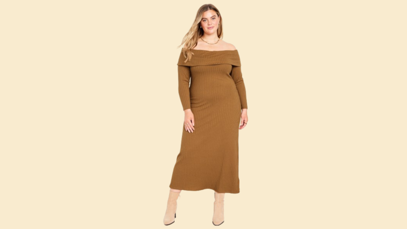 A model wearing a brown off-the-shoulder sweater dress.