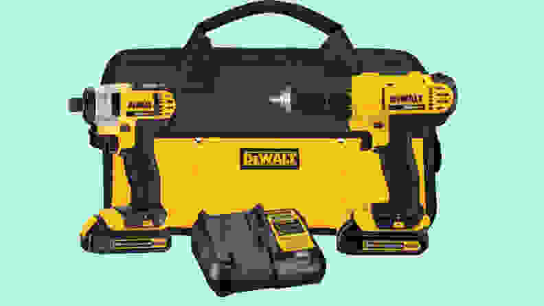A close-up of the Dewalt DCK240C2 combo kit, which includes the DCD711 drill and driver, the DCF885 impact driver, a battery charging station, and the contractor bag everything comes in.