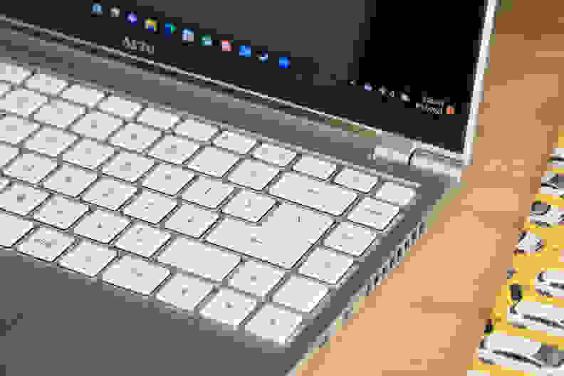 A close-up view of the side of the Gigabyte Aero 14 OLED laptop and keyboard.