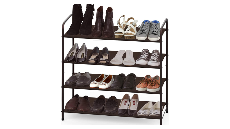 Four-tier shoe rack filled with shoes on a white backdrop