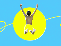 A boy jumps into the sun wearing yellow swim trunks