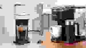 Left: white Nespresso machine with frothy cup of coffee. Right: Keurig machine with white mug full of coffee.