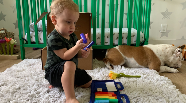 A child plays with art supplies