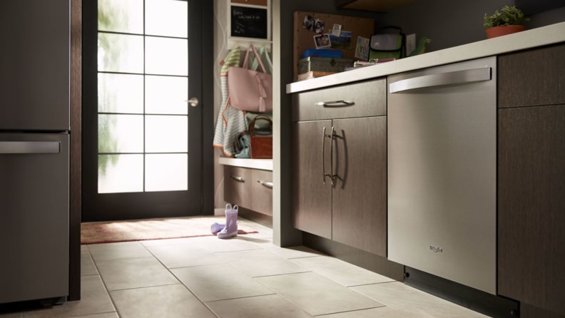 A Whirlpool smart dishwasher in a cozy kitchen