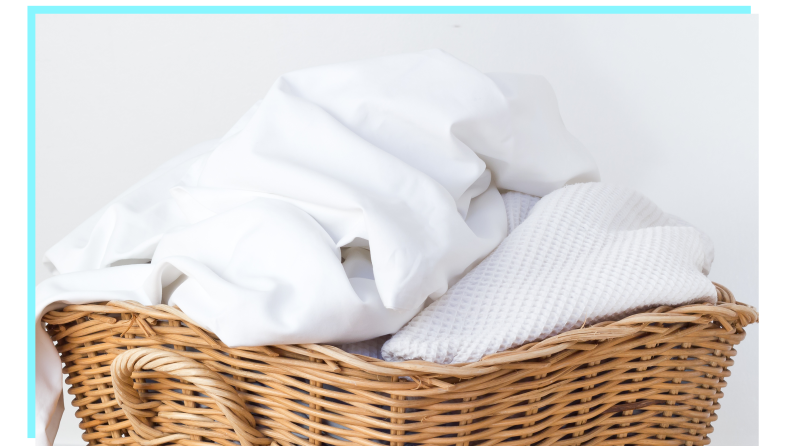 A basket full of white sheets.